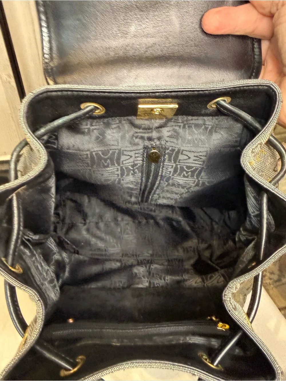 Metrocity Signature Canvas Backpack with black leather trim and gold hardware